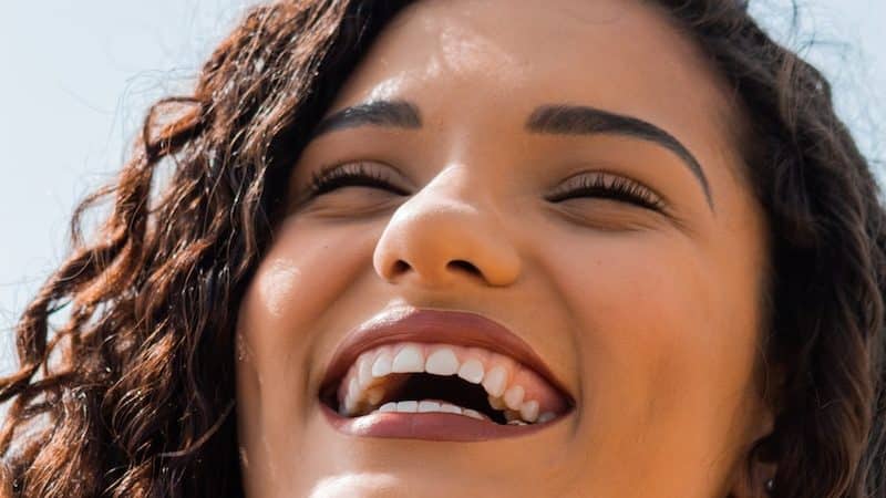 woman with brown hair smiling